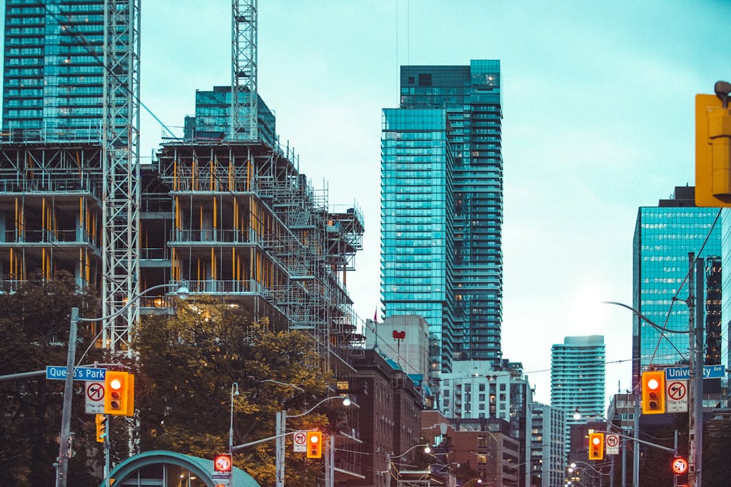 A bustling downtown cityscape with high-rise buildings and ongoing construction, highlighting urban development.
